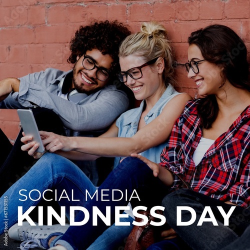 Composite of social media kindness day text over diverse friends taking selfie with cellphone
