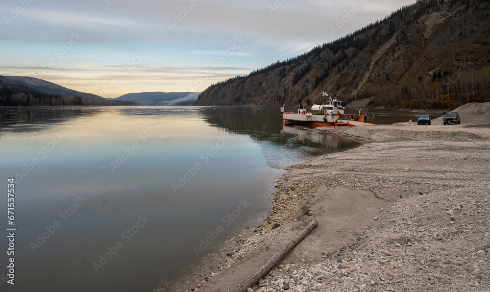 Morning view of the ferry connecting the “Top of the World Highway” and the “North Klondike Highway” over the Yukon River at Dawson City