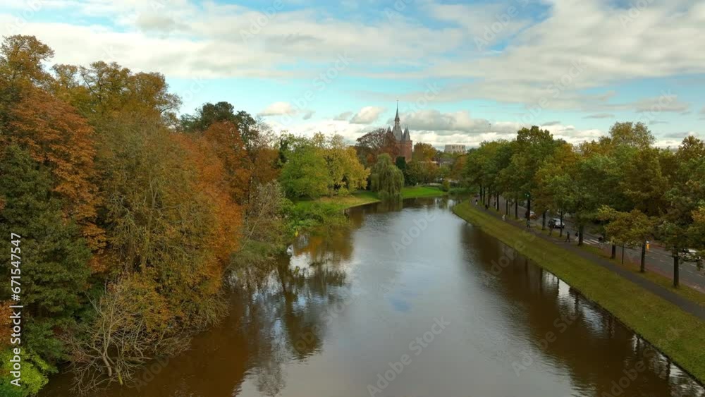 Zwolle downtown district aerial view at the Sassenpoort during a nice fall day. Seen from above we can see the luscious fall foliage on the trees with various historical buildings in the background. Zwolle downtown district aerial view at the Sassenpoort during a nice fall day. Seen from above we can see the luscious fall foliage on the trees with various historical buildings in the background.