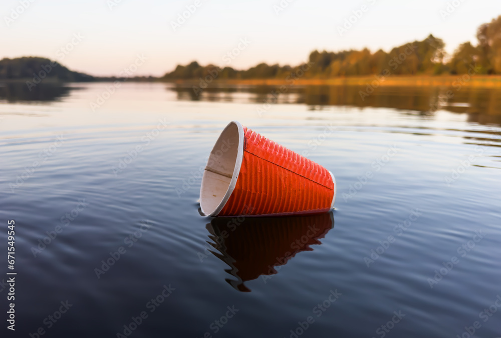 Water pollution. Coffee paper cup Garbage. Marine pollution. Aquatic ...