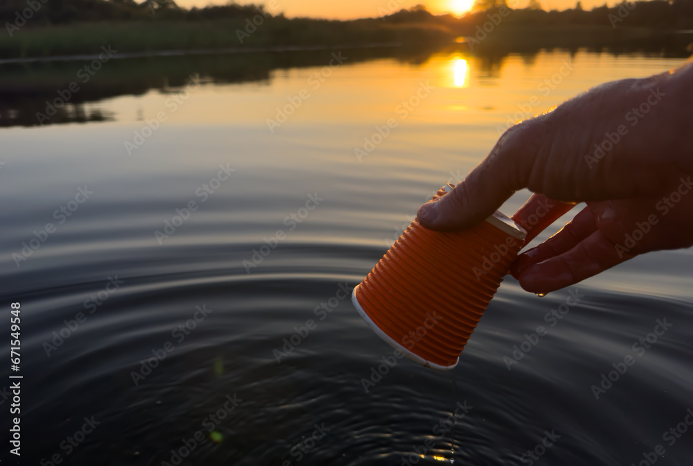 Water pollution. Coffee paper cup Garbage. Marine pollution. Aquatic ...