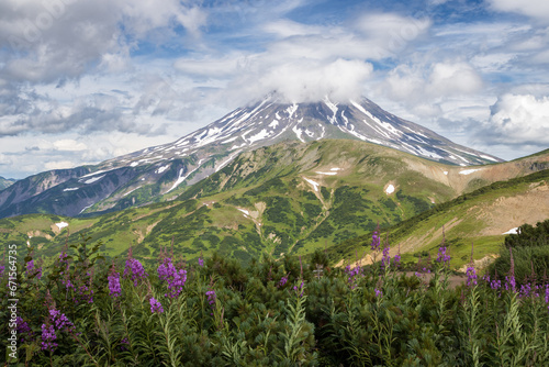 View of the volcano. Travel and tourism on the Kamchatka Peninsula. Beautiful nature of Siberia and the Russian Far East. Vilyuchinsky Volcano (Vilyuchinskaya Sopka), Kamchatka Territory, Russia.