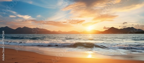 Sunset over the mountains at Pak Meng Beach Thailand