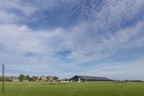 Modern farm between meadows. Ternaard Friesland Netherlands.  photo