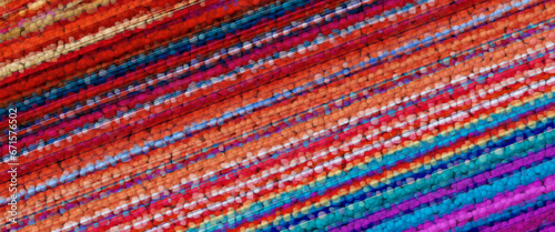 intense beaded pattern and design in magenta red orange turquoise striped curved pattern on a black background