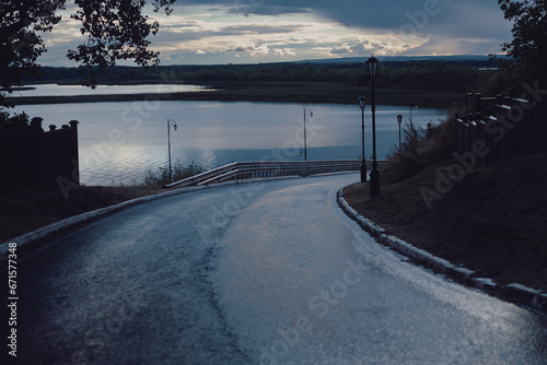 The asphalt road turns to the river © V_Saratovtseva