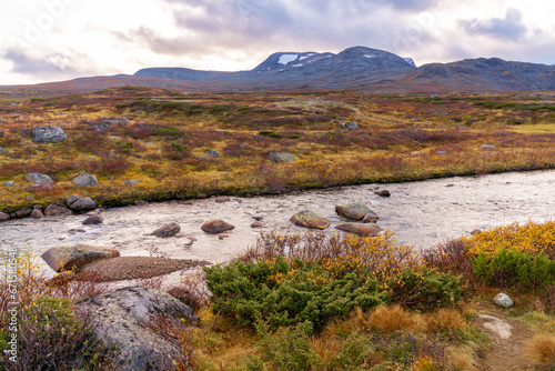 Typical landscape in Jotunheim National Park in Norway during autumn time in the Beitostølen area overlooking the Leirungsae River photo