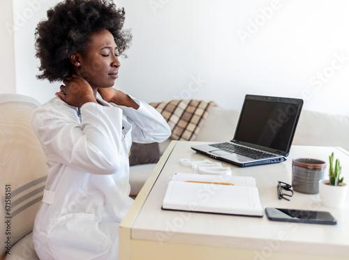 Healthcare, black woman and doctor with neck pain, burnout or overworked in hospital, laptop or muscle strain. Medical professional, African American female or lady with tension, stress or frustrated.