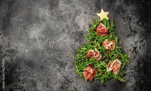 Jamon Prosciutto and arugula Salad, Christmas food tree Antipasto. Long banner format. top view