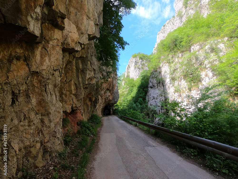 A beautiful canyon with a narrow road. Sunny day in the nature.