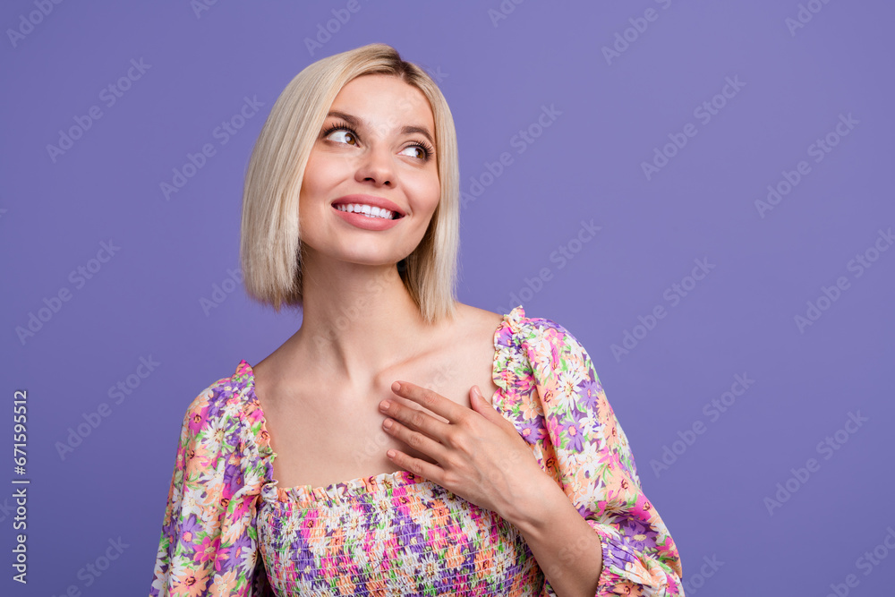 Photo of pretty positive lady arm touch chest beaming smile look empty space imagine isolated on violet color background Photo of pretty positive lady arm touch chest beaming smile look empty space imagine isolated on violet color background