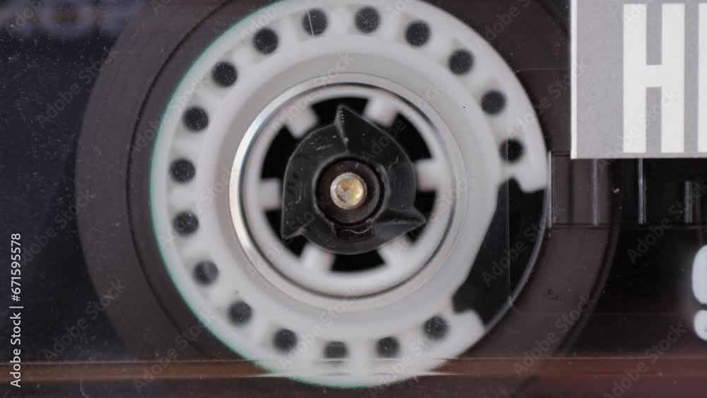 Retro radio tape recorder, audio cassette close-up. Listening to music, old radio boom box player, macro of vintage music listening. Retro radio tape recorder, audio cassette close-up. Listening to music, old radio boom box player, macro of vintage music listening.
