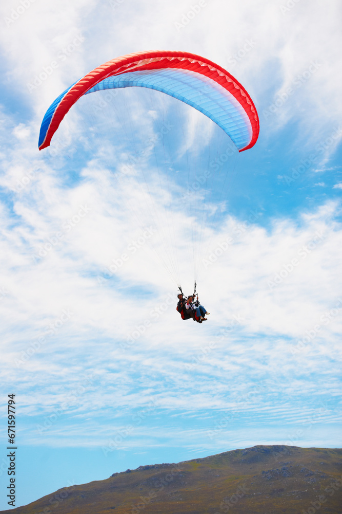 People, paragliding and freedom in sky, mountain or extreme sport with smile for fitness. Coach, partnership and person on adventure, clouds or fearless with backpack, parachute or flight in summer People, paragliding and freedom in sky, mountain or extreme sport with smile for fitness. Coach, partnership and person on adventure, clouds or fearless with backpack, parachute or flight in summer