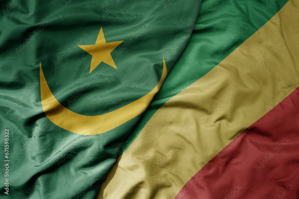 big waving national colorful flag of mauritania and national flag of republic of the congo . big waving national colorful flag of mauritania and national flag of republic of the congo .