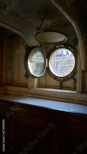 Interior of a ship with a porthole.