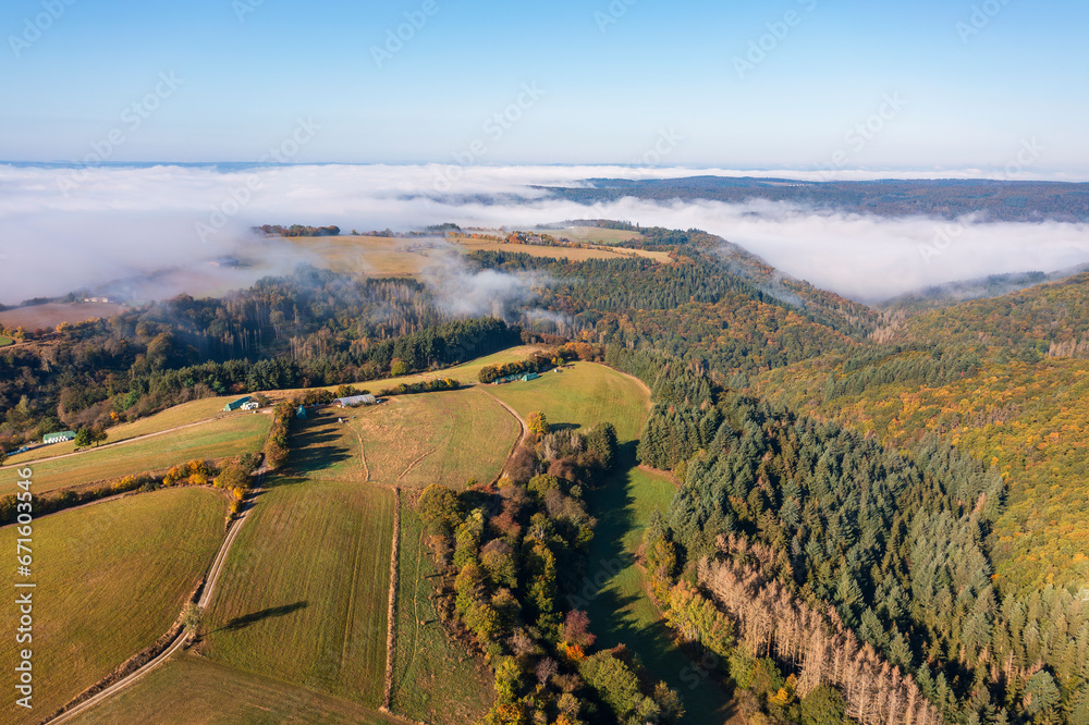 Bird's-eye view of the Taunus forests in the Wisper Valley near Presberg/Germany in autumn with morning fog