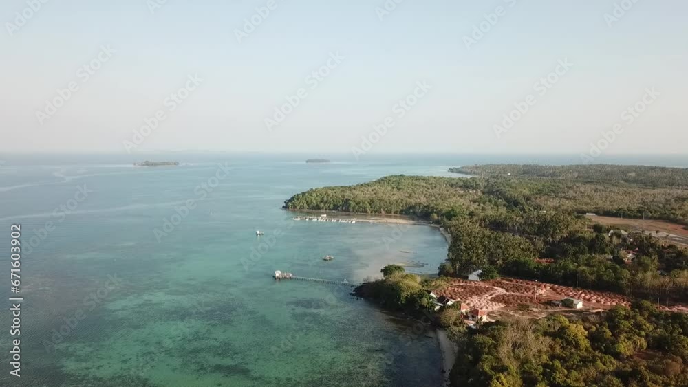 Aerial View of Serene Countryside Embracing a Beautiful Beach, a Perfect Blend of Nature's Beauty Aerial View of Serene Countryside Embracing a Beautiful Beach, a Perfect Blend of Nature's Beauty