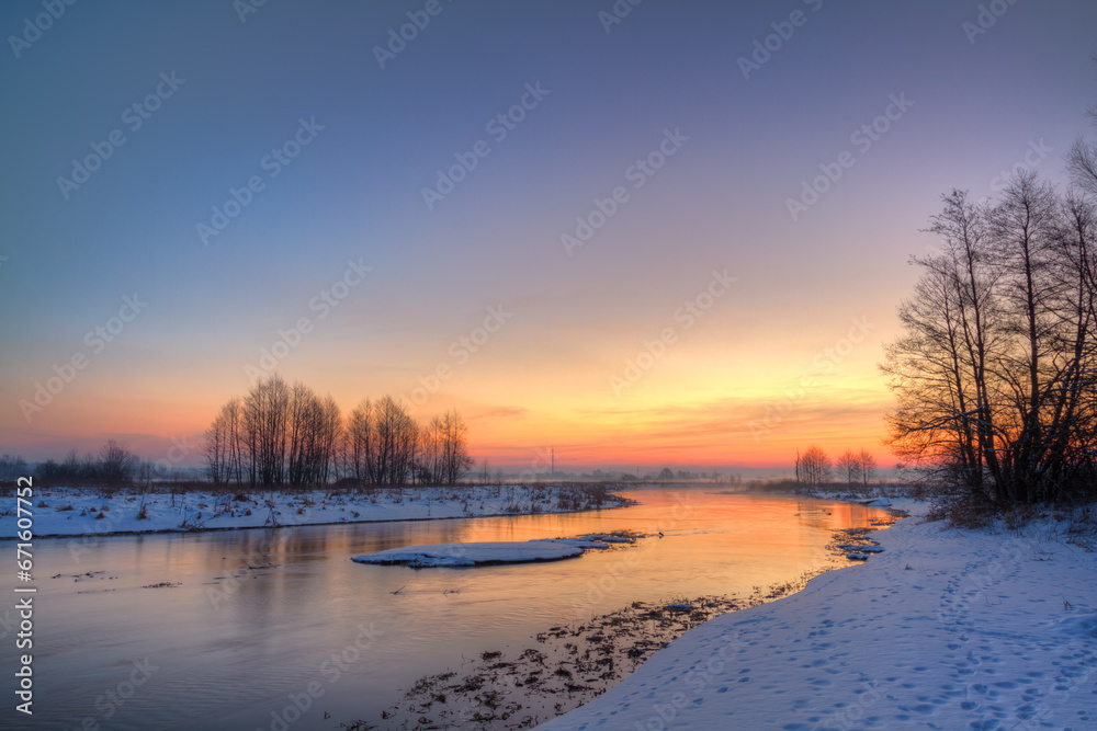 Winter landscape, amazing sundown in winter , Poland Europe, river valley Knyszyn Primeval Forest