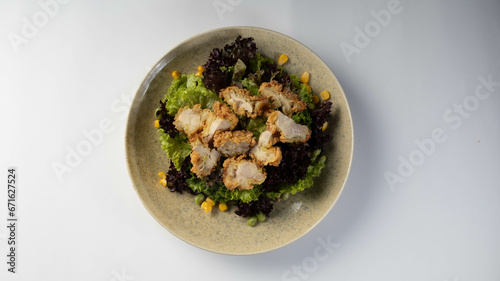 Deep-fried chicken breast salad with corn. Korean cuisine dish