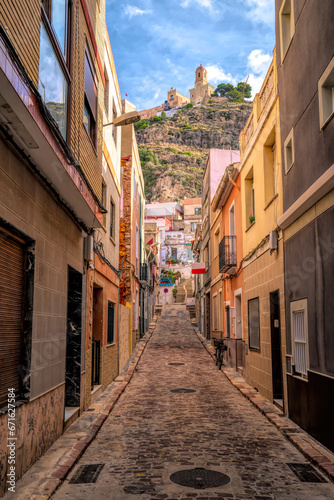 Cullera narrow street castle view in historic old town Valencian Community Spain