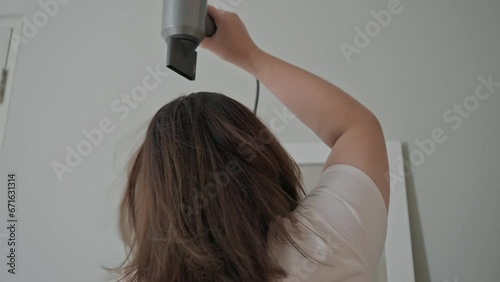 Asian woman hair drying