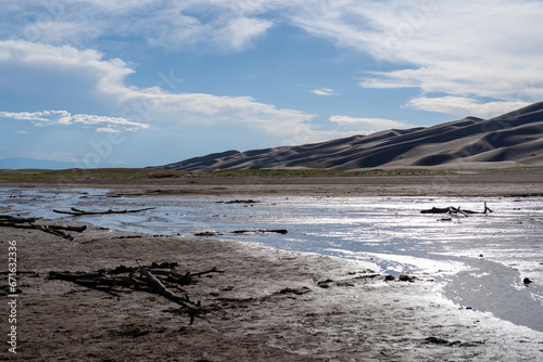 Medano Creek beach in Great Sand Dunes National Park in Colorado on a sunny summer day © Sitting Bear Media