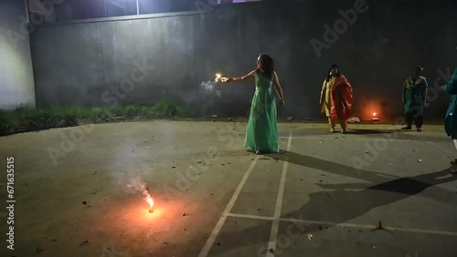 Woman lights of fireworks. Sparkles lights. Diwali fireworks, Festival of lights. Deepawali festival. Hindu holidays. Seasonal. Firecrackers lights.
