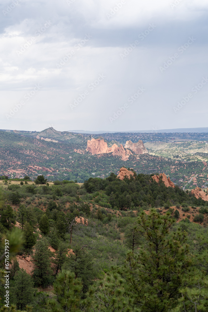 A view of Garden of the Gods from afar on a cloudy summer day in Colorado Springs, CO