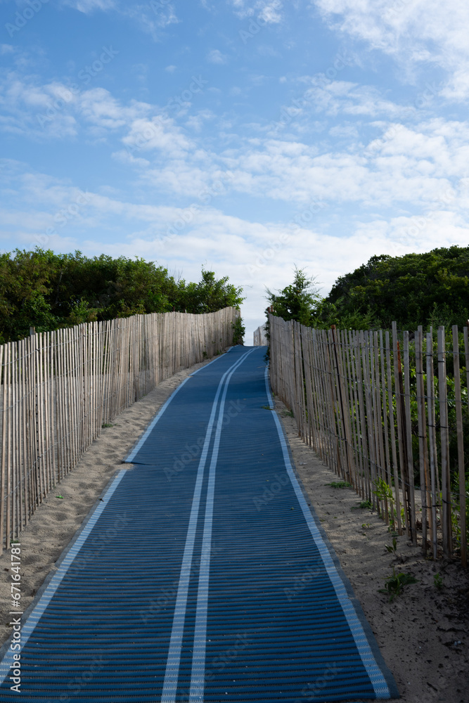 Blue path through the dunes at the beach