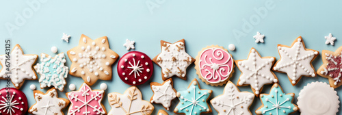Magical sugar icing Christmas cookies on pastel hues background with empty space for text 