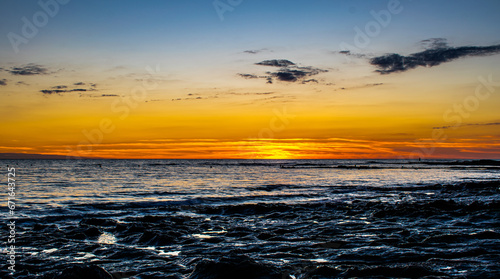 Sunset with a gradient of orange on the ocean  Sauzaie beach in Br  tignolles-sur-Mer  Vend  e  FRANCE.