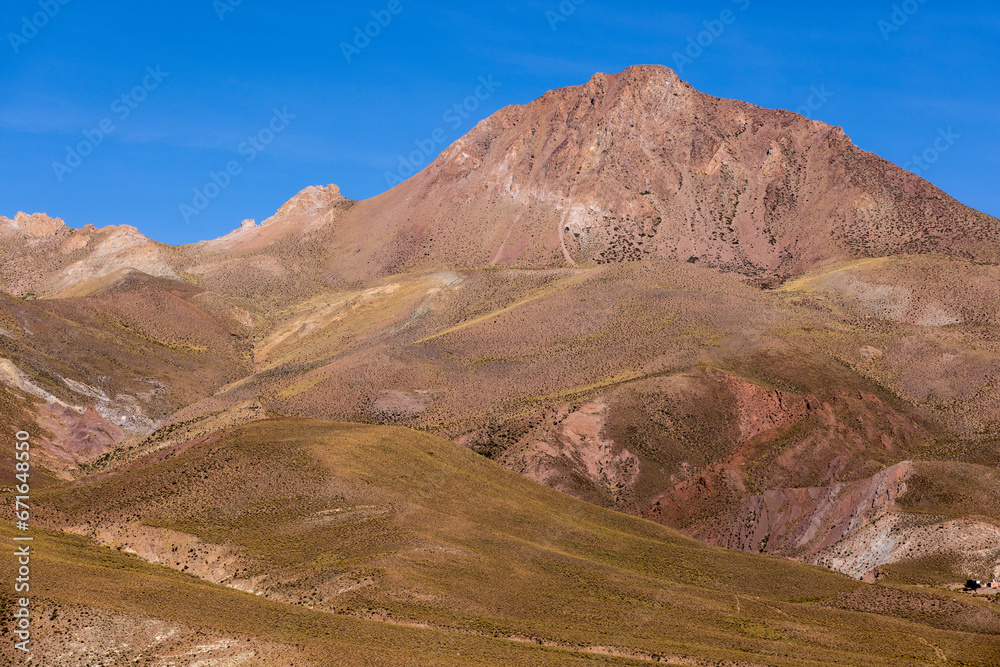 Traveling the famous Ruta40 in the scenic Argentinian highlands - fantastic views while driving through colorful and remarkably shaped mountains and watching wildlife in high altitude in South America Traveling the famous Ruta40 in the scenic Argentinian highlands - fantastic views while driving through colorful and remarkably shaped mountains and watching wildlife in high altitude in South America