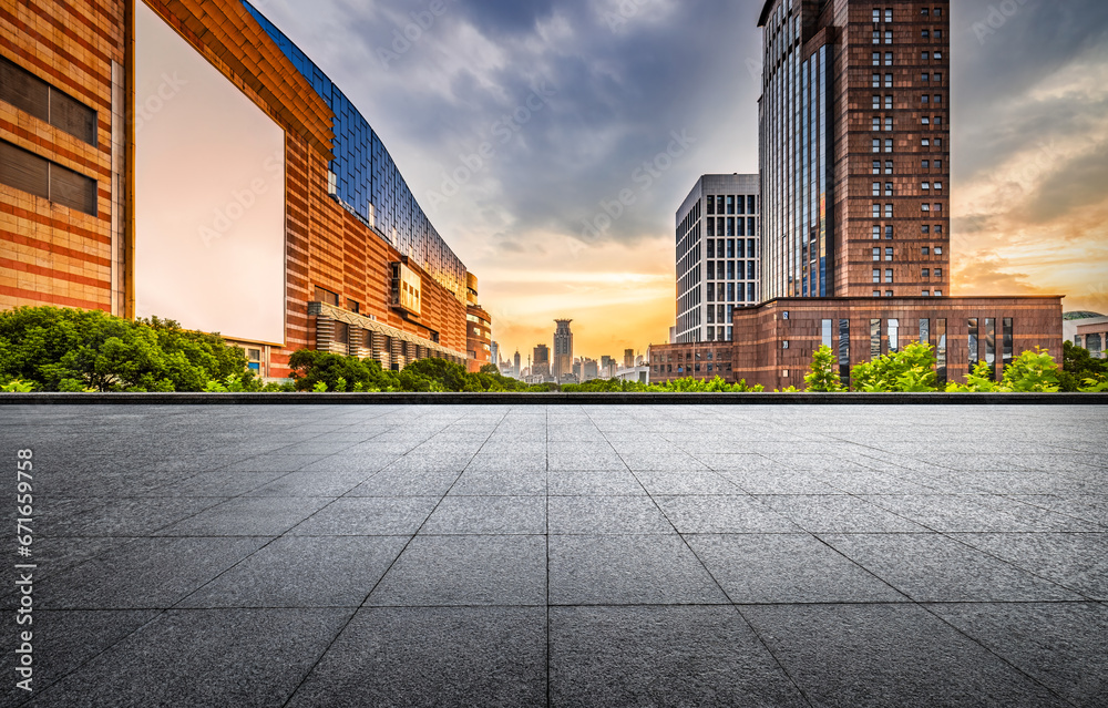 Brick floor and city buildings skyline in Shanghai at sunset