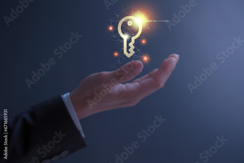 person holding virtual holographic key icon with light blurred background. Data protection privacy security and success business goal concept 