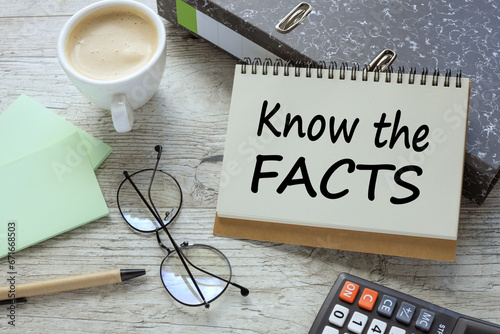 Wallpaper Mural KNOW THE FACTS a cup of coffee. glasses. two office folder gray notepad. text on the page Torontodigital.ca