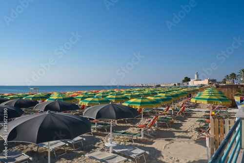 parasols on the sandy beach in Manfredonia town, photo