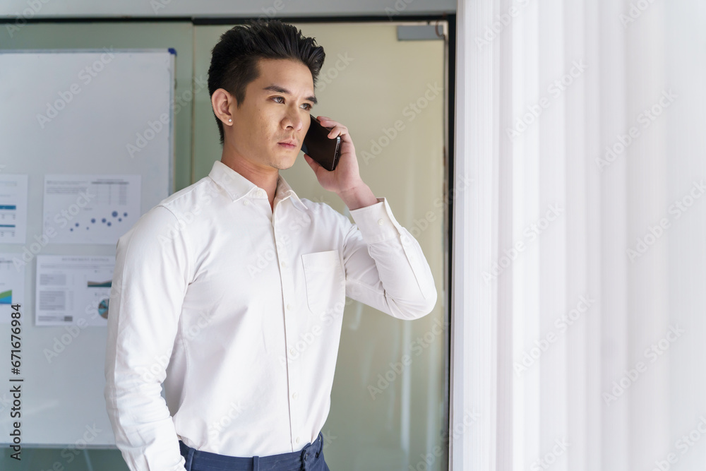 Asian Business man working with laptop. Young business man thinking Concentrated at work Asian Business man working with laptop. Young business man thinking Concentrated at work