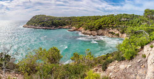 Panoramic view of Bay Cala Mitjana at south coast of Menorca (Balearic Islands)
