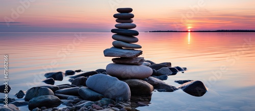Silhouette of stone pyramid by Baltic Sea at sunset Spiritual scenic landscape shot from Poel island