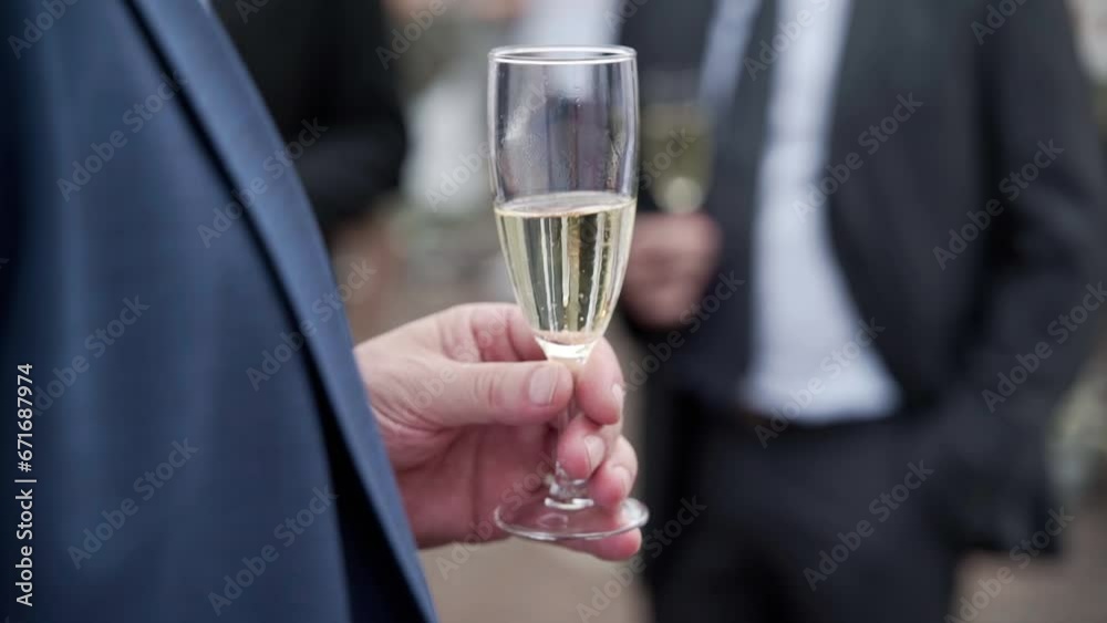 men in suits drinking wine while talking men in suits drinking wine while talking