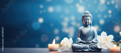 Buddhist holy day celebrating Siddhartha Gautama White flower adorned Buddha statue on blue backdrop Mental well being and meditation theme Soft focus room for text photo