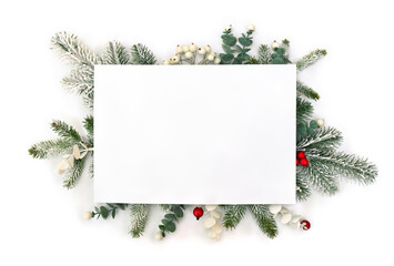 Christmas decoration. Branch christmas tree, berries mistletoe, red berries with white paper card note with space for text on white background. Top view, flat lay