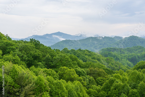 Green trees with layers of mountains in the background - Appalachian Mountain, Blue Ridge Mountains, Boone, NC, summer