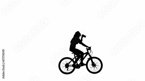 Portrait of female model. Black silhouette of girl riding a bike and drinking water from bottle. Isolated on white background alpha channel.