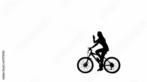 Portrait of female model. Black silhouette of girl on a bike waving hand, greeting someone. Isolated on white background with alpha channel. © kinomaster