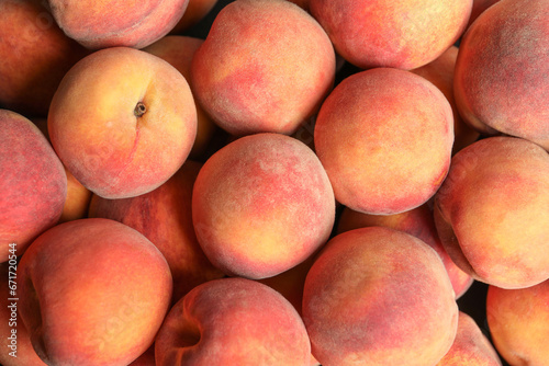 Many fresh peaches as background  top view