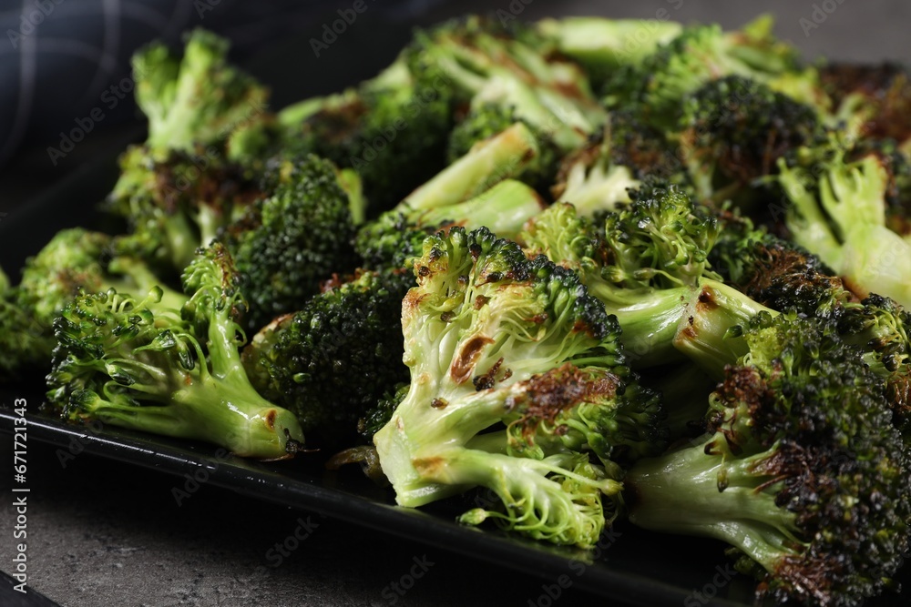 Tasty fried broccoli on table, closeup view