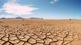 Desolate dry earth, cloudy blue sky over the dried, cracked nature scene. Concept of water scarcity, environmental problem, climatic changes. Exode of population due to hunger. 