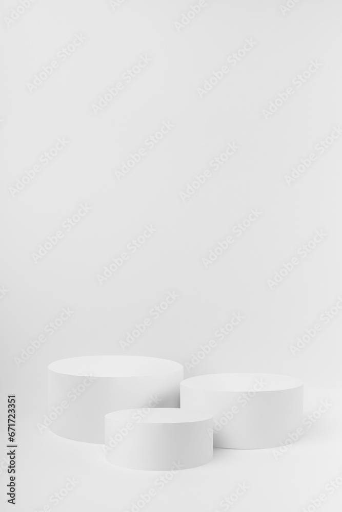 Abstract three white round podiums for cosmetic products as mockup on white background. Scene for presentation products, gifts, goods, advertising, design, sale, text, display, showing. Abstract three white round podiums for cosmetic products as mockup on white background. Scene for presentation products, gifts, goods, advertising, design, sale, text, display, showing.