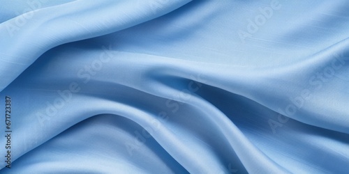 A close up photograph showcasing the texture and color of a light blue fabric. This image can be used for various design projects or as a background element